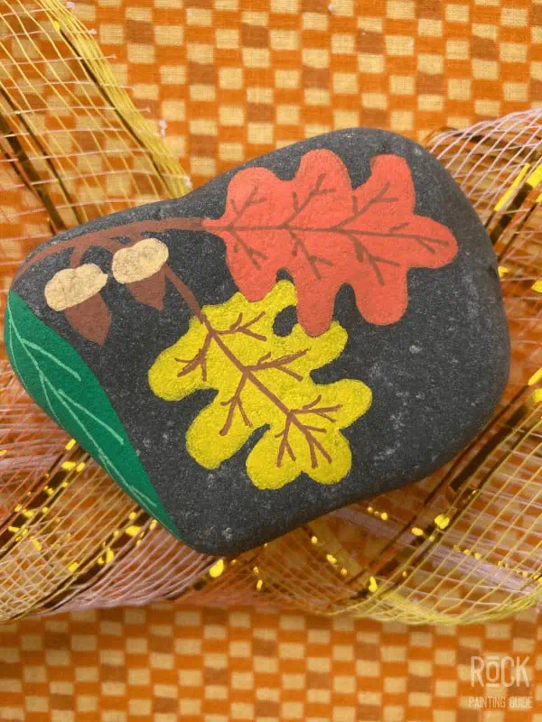 40 Cozy Autumn Rock Painting Ideas to Fall In Love With 3 fall leaves painted rock with acorns